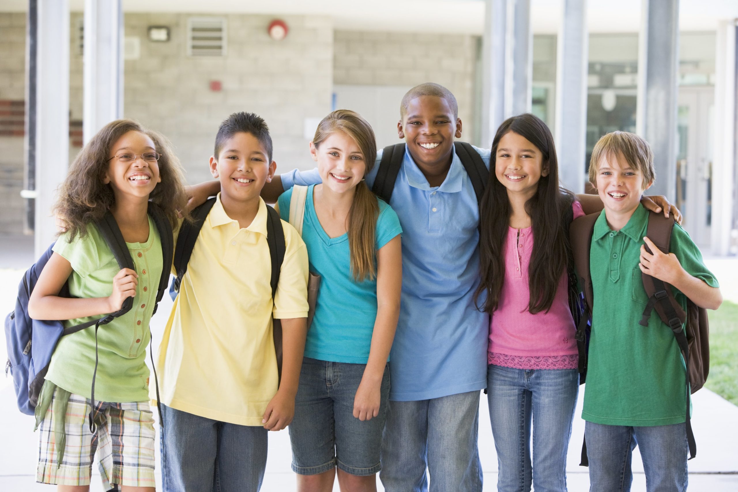 smiling diverse kids at school